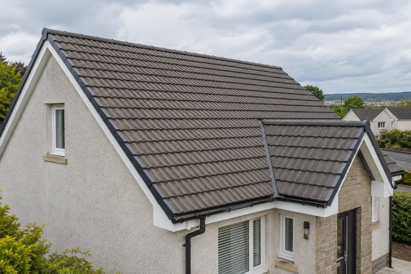 Interlocking tiled domestic roof and ridge