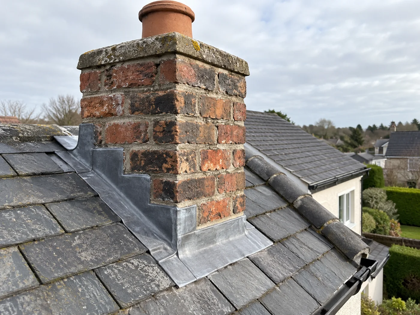 Brick chimney pointing and lead apron