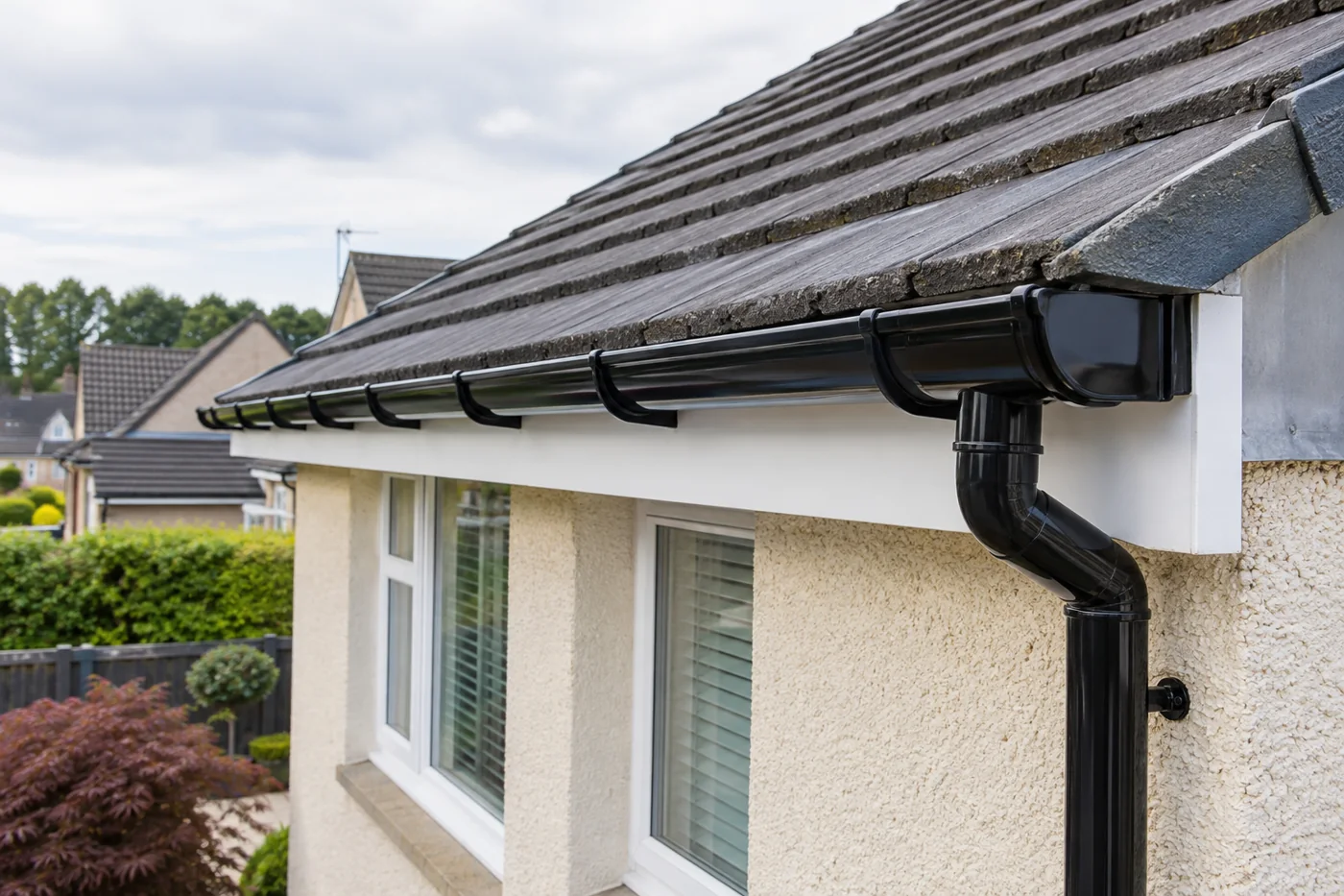 Gutter run and brackets along a roof edge